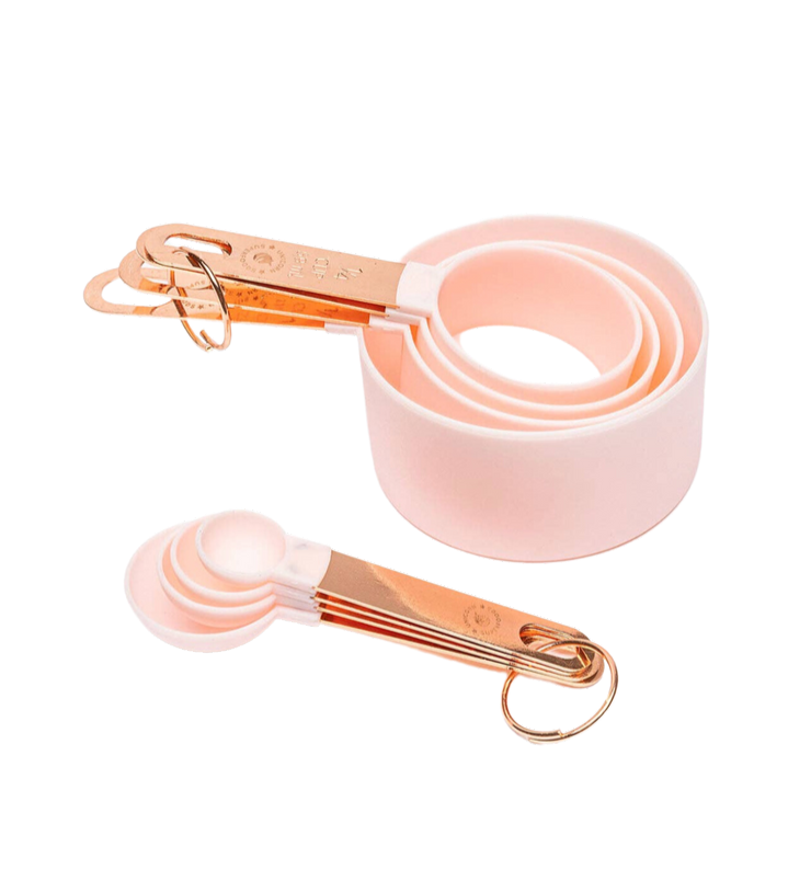 baby pink measuring cup and spoon set with rose gold handles