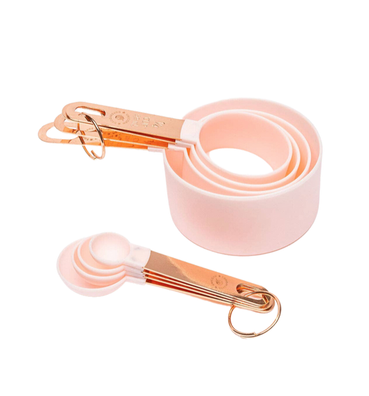 baby pink measuring cup and spoon set with rose gold handles